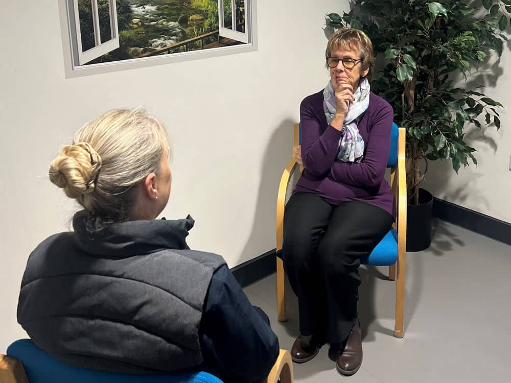Patient and counsellor discussing psychological wellbeing